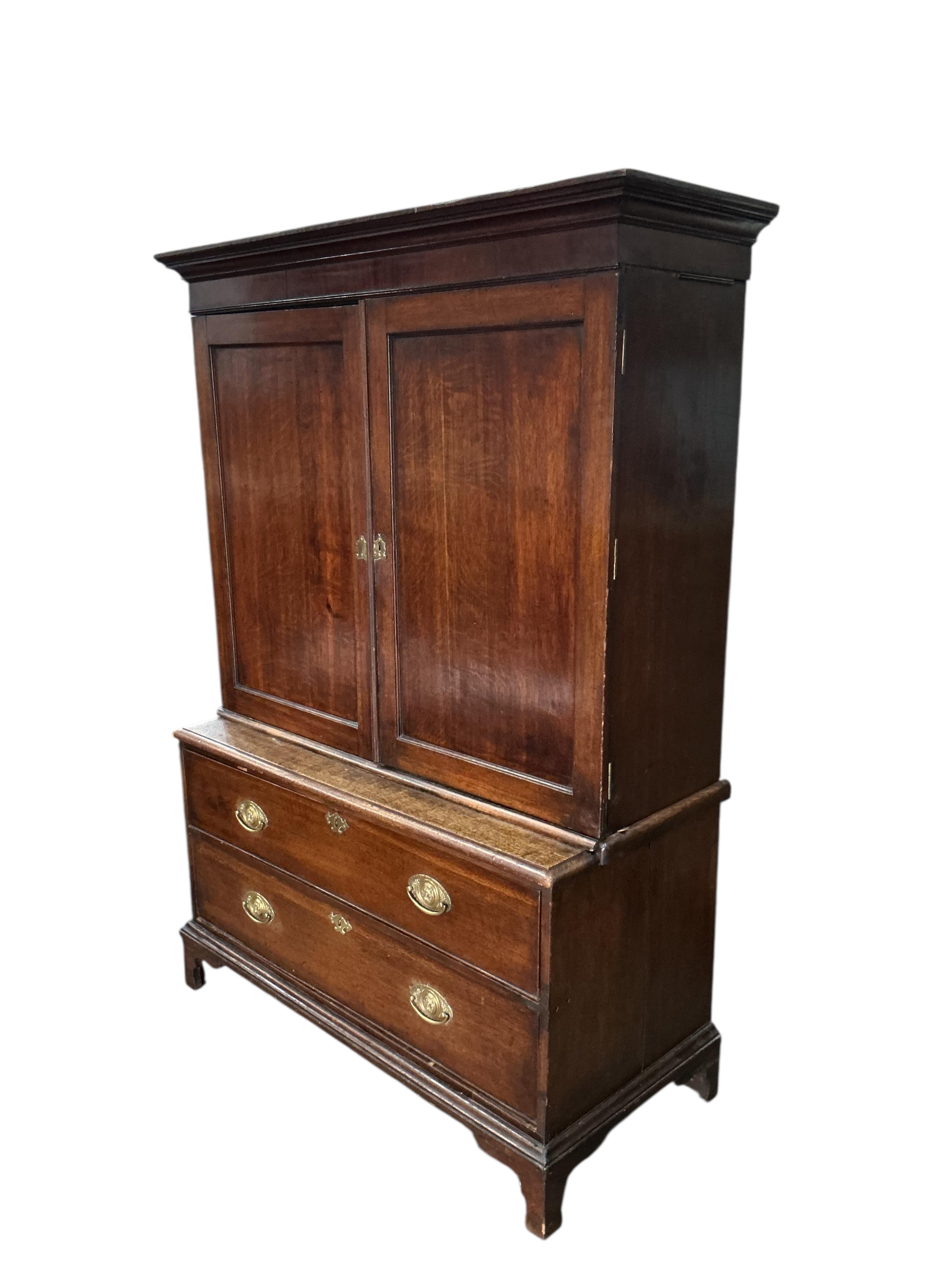 A George III oak mahogany cabinet on chest, adapted, width 115cm, depth 53cm, height 171cm